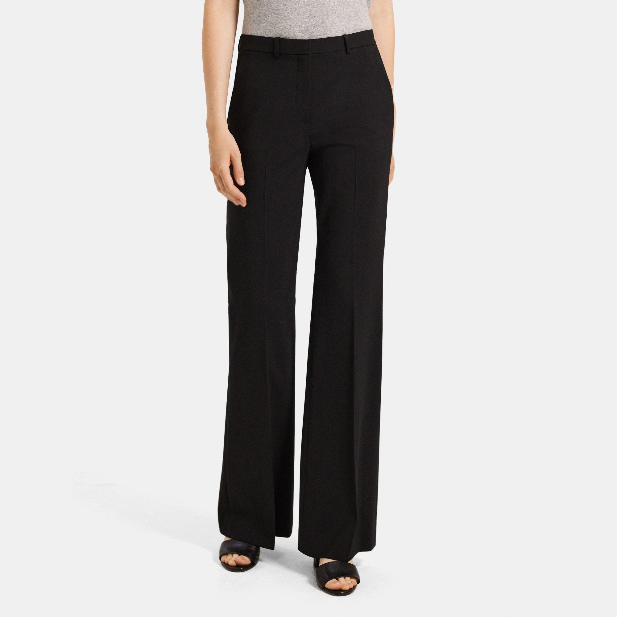 High-rise flared wool pants in black - Saint Laurent